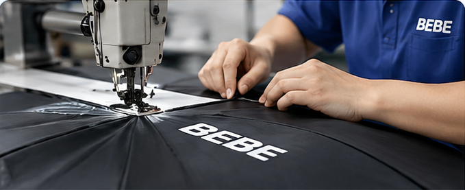 Illustration of sewing a black umbrella canopy with BEBE branding